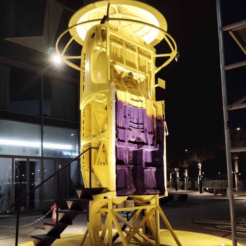 Custom Yellow and Purple Lighthouse Event Prop Installation in Ras Al Khaimah