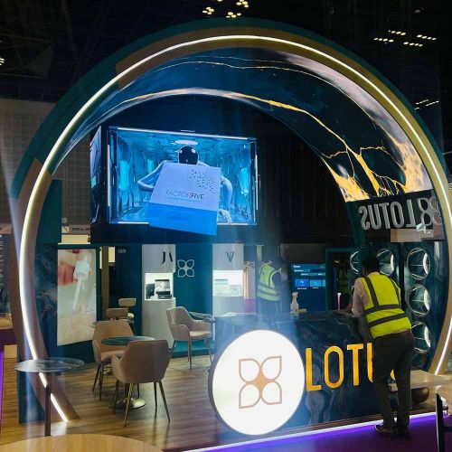Premium Lotus Booth Design with Arched LED Screen Entrance in Ras Al Khaimah